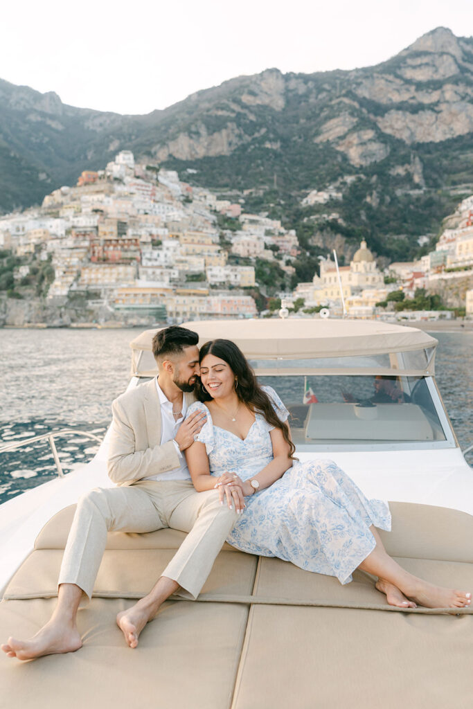 Amalfi Coast boat proposal at sunset with couple on luxury yacht near Positano