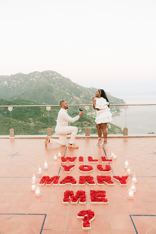 Luxury proposal setup on Amalfi Coast with premium flowers candles and elegant decoration
