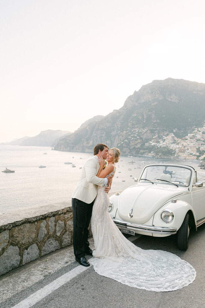 bride and groom exploring Positano in vintage car after elopement ceremony