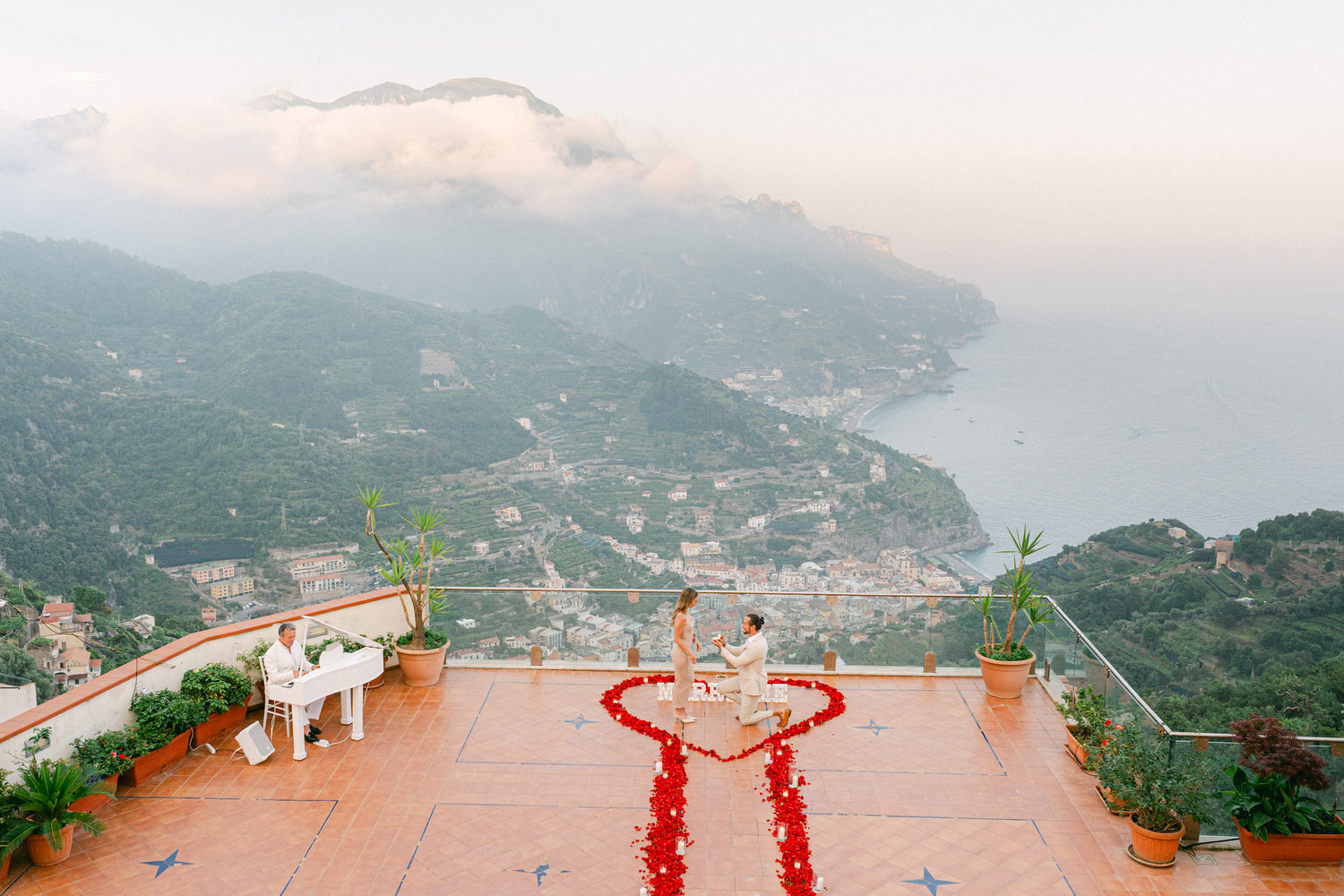 romantic marriage proposal in Ravello on a private terrace at Hotel Bonadies overlooking the Amalfi Coast at sunset